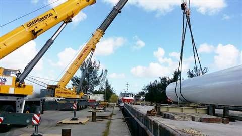 The tanks are offloaded from the barge using a using a Grove GMK5275 and a Grove GMK5240 hydraulic a