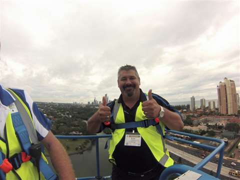 Brian Clifford, Genie regional sales manager for Queensland, Australia, at full height in the SX-180