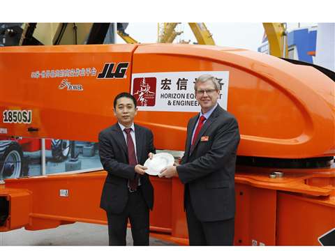 Shanghai Horizon Equipment &amp; Engineering Company's president, Jiayin Wang, left, and JLG Industr