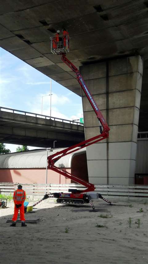 The hinowa 26.14 set up on a sand bank
