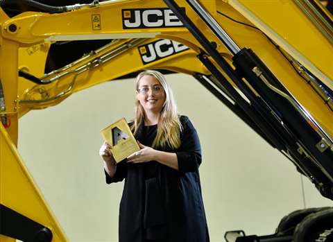 Holly Broadhurst, design engineer, JCB, collecting her Higher and Degree Apprentice Award  