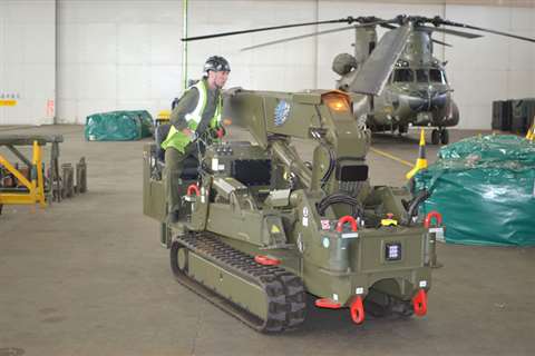 The mini cranes are being used to carry out maintenance and repair work on the military helicopters