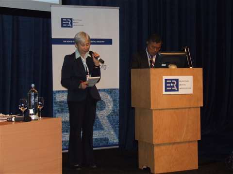 Yoshitoshi Kadogushi (R), head of the Japanese Rental Association, speaks at IRE