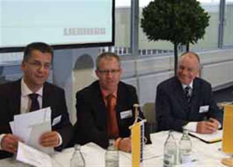 Joachim Strobel and Matthias Herzog, general managers at Liebherr-Hydraulikbagger and Henning Rapp, 
