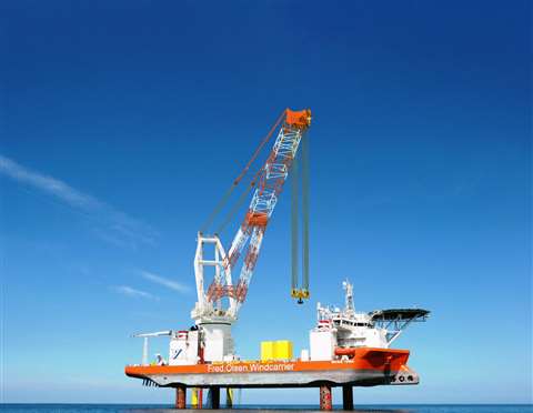 Artist impression of Huisman 1,600 tonne capacity lattice boom leg encircling crane for Fred Olsen Windcarrier installed on the jack-up vessel in the sea