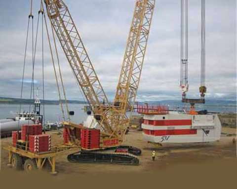 The 128 tonne top section is lifted onto the turbine mast