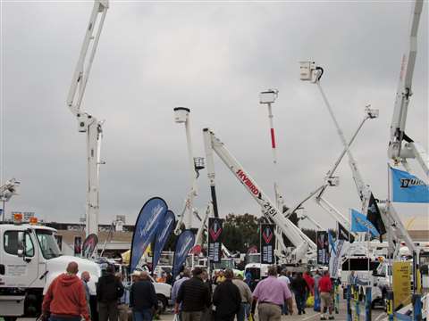 Versalift's new Skybird T215I extends horizontally in the background at ICUEE.