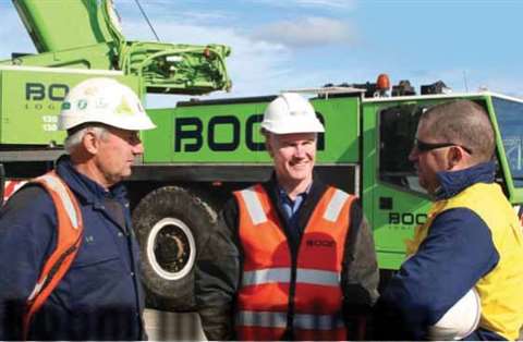 Mark Lawrence, Boom Logistics CEO, centre, with crane operators Lou Cibura, left, and Brent Stacey. 