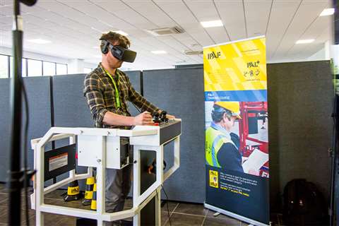 A visitor tries out the VR simulator IPAF's Vertikal Days 2019 stand