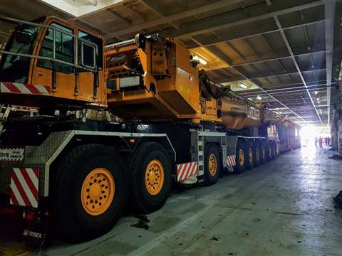 Steel Carriers Infrastructure's yellow Demag AC 1000-9 all terrain crane inside a large building