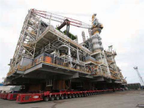 The 11,300 tonne utilities deck is transported towards the barge