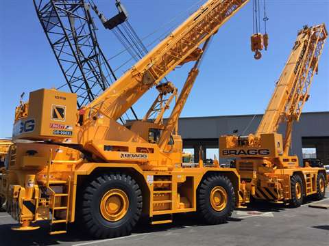 Bragg Crane Service’s new rough terrain cranes in their yard
