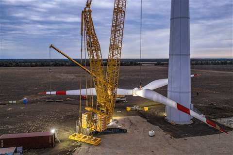 Using the yellow Liebherr LR 1500 lattice boom crawler crane to assemble wind turbines