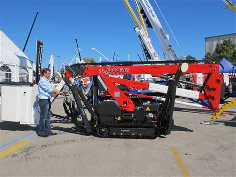 Mike Hrycak, president of Tracked Lifts, lowers the boom of the new Platform Basket 18.90/46 kV at I