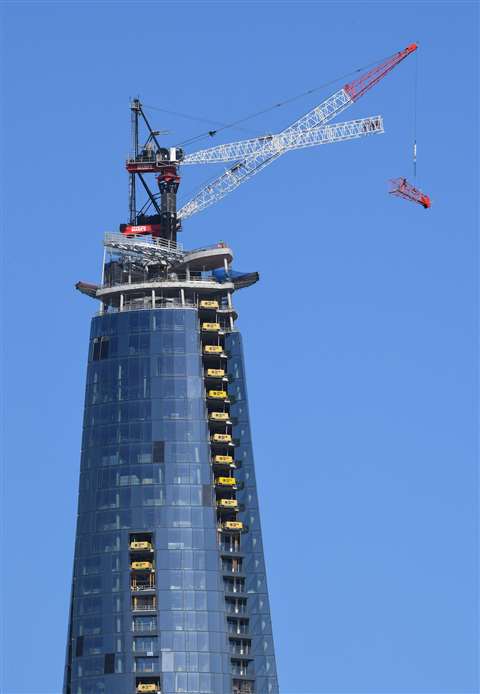 A section of the M390D's boom being lowered as dismantling begins. Photo: Getty