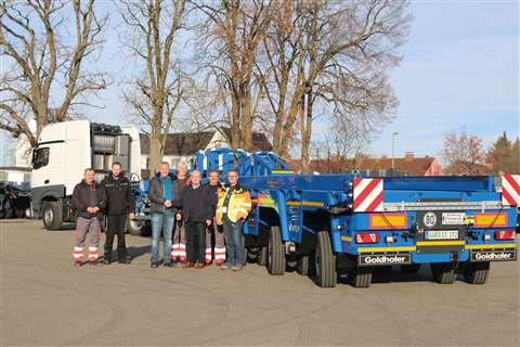 Günther Vogel, Goldhofer area sales manager (centre right) shaking hands on the first Ventum with Enercon's Uwe Ringering and his team