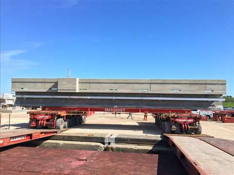 Rolling the shoulder spans onto barges to be set