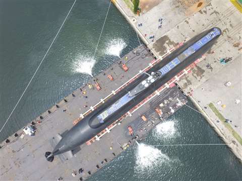 The KRI Alugoro being transported onto the floating dock