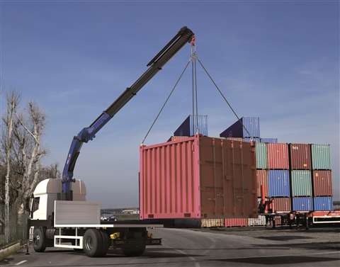 Amco Veba VR23NG with continuous slewing in dark blue lift a red oxidetype coloured 20 foot ISO container