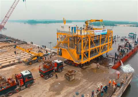 Cranes R Us used Faymonville G-SL modular trailer, aerial view of load out onto barge at port in Nigeria